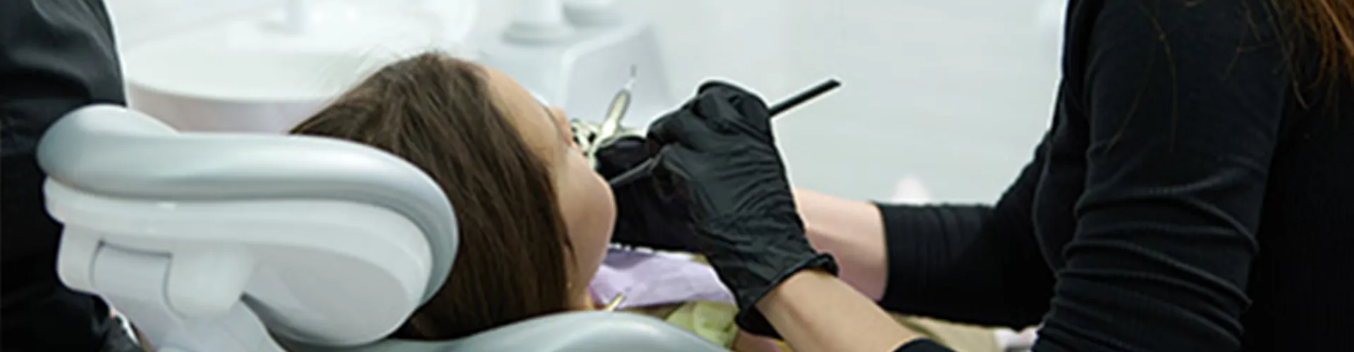 Woman having her teeth cleaned.