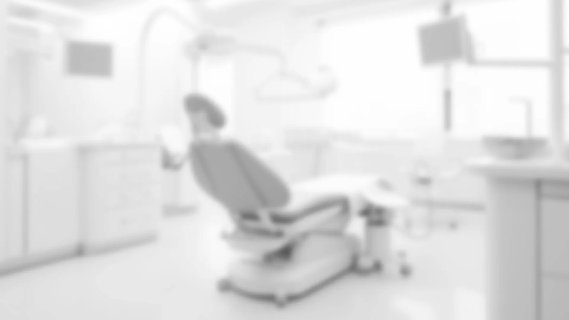 Modern dental chair in a clean, bright dentist office.