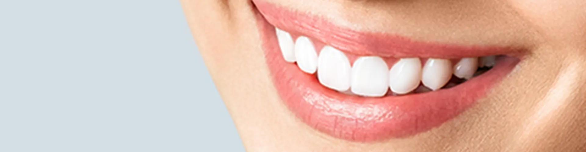 Close-up of a woman smiling.