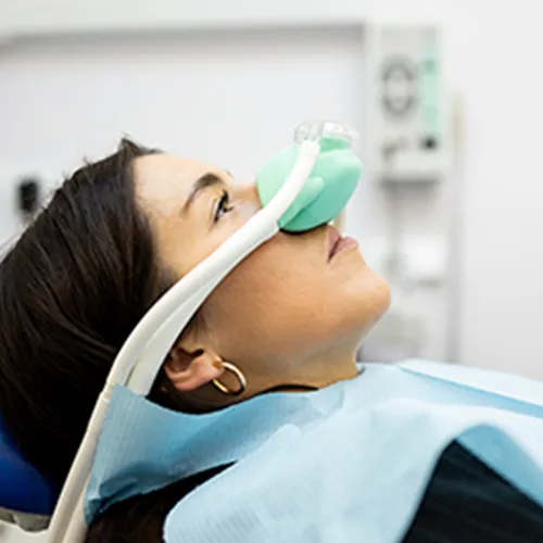 child-in-dental-chair-with-breathing-mask-over-nose