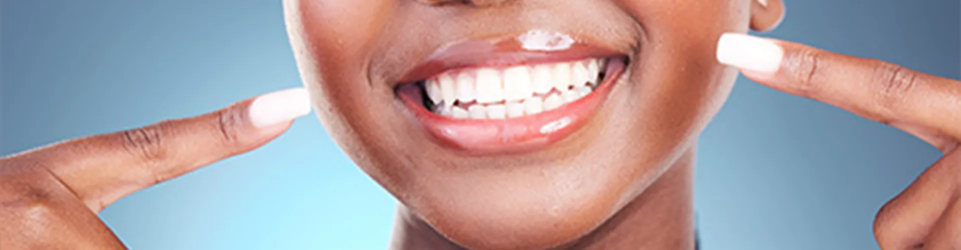 Close-up of a smiling mouth showing teeth.