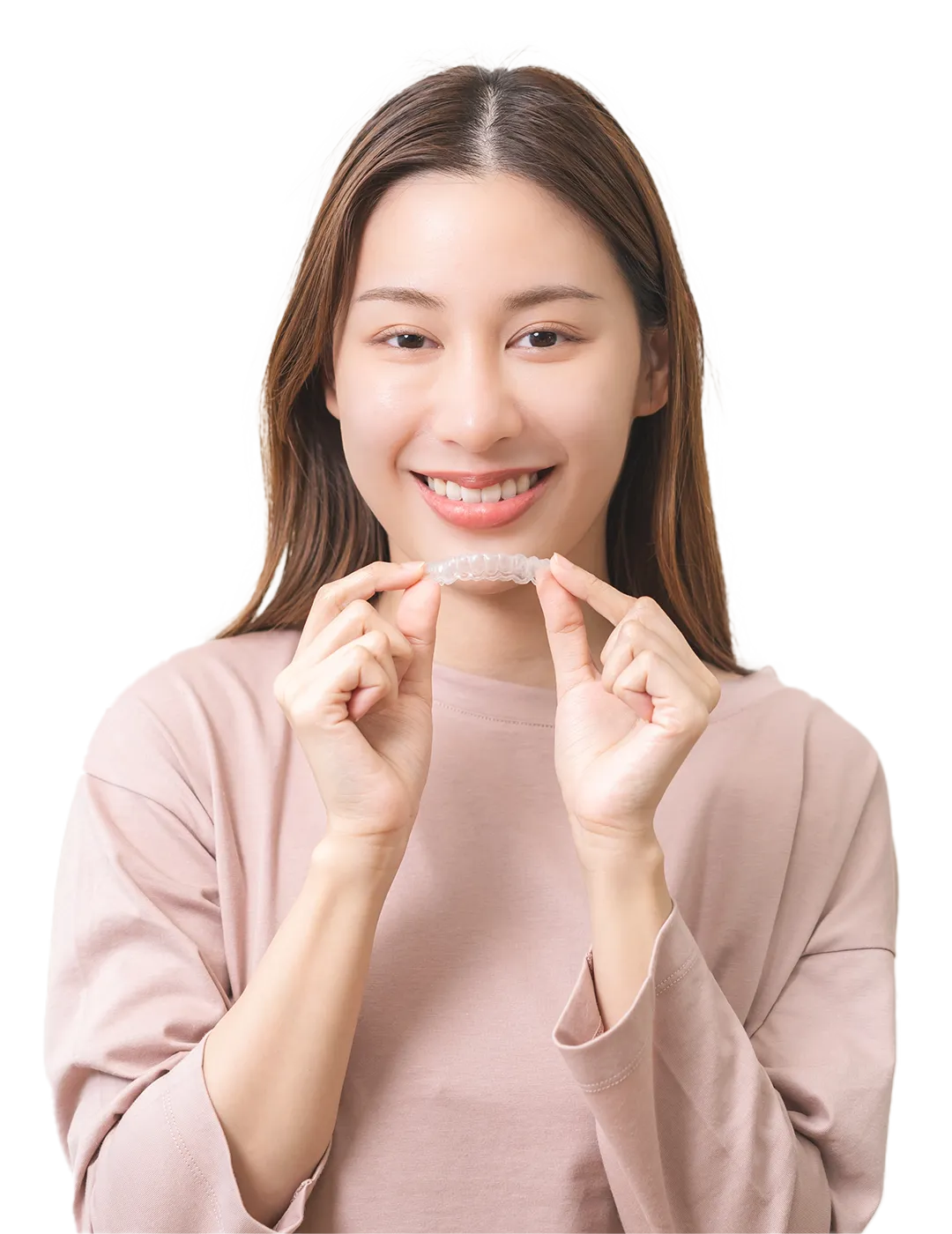 Happy woman showing clear teeth aligners.