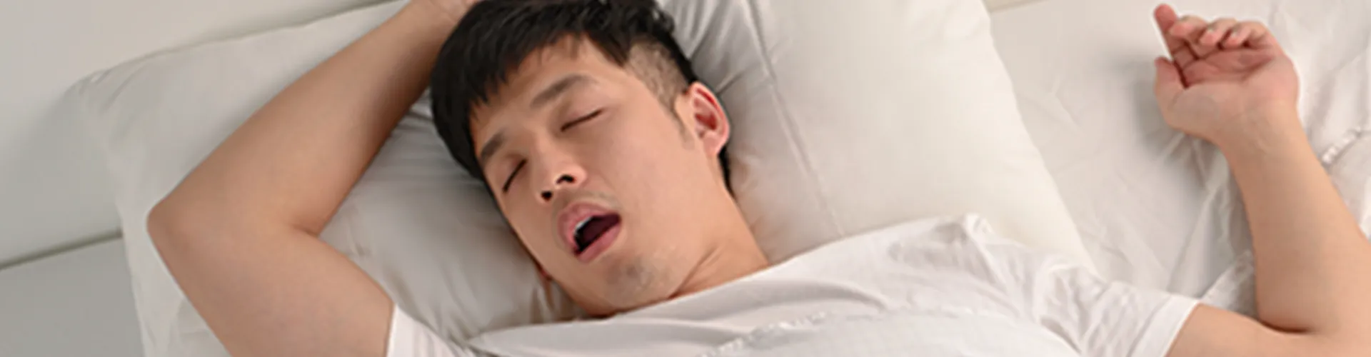 A man sleeping with his mouth open.