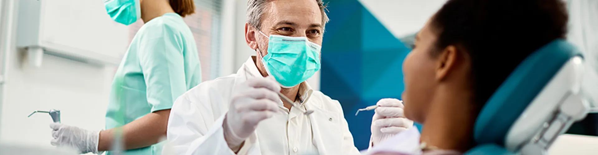 A dentist working with a patient.