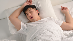 man asleep on back with mouth open