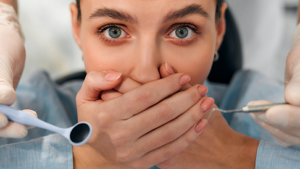 woman covering her mouth